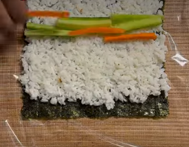 Assembling and rolling vegan sushi rolls